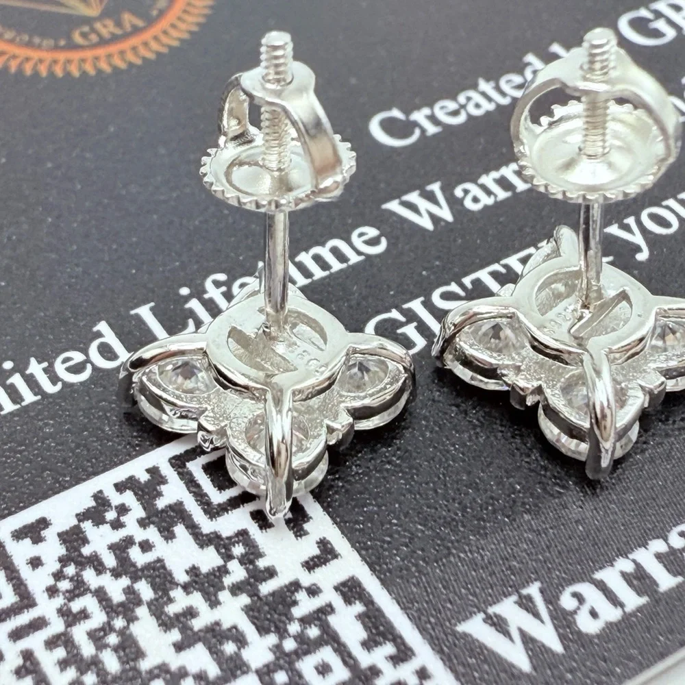 1.6ct Moissanite Cross Over Stud Earrings . Platinum plated .